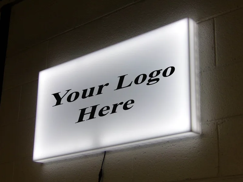 A blank illuminated light box reading Your Logo Here, used to show a sign concept