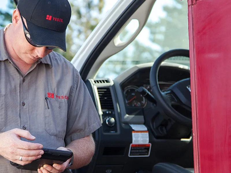 VH technician working from a tablet in the service van during a site survey